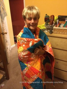 Aidan with quilt